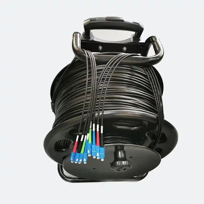 Carrete de cable de fibra óptica retráctil portátil con longitud 100M 200M 500M Cordón de parche de fibra óptica táctica blindada
